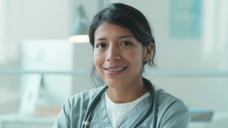 Portrait-of-Cheerful-Hispanic-Female-Doctor-in-Clinic